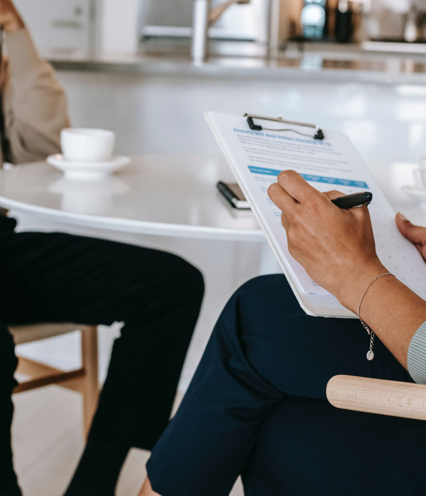 Child and adult psychiatrist taking notes.